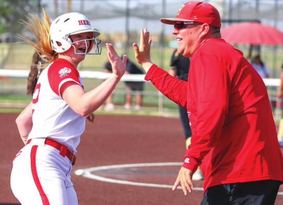 Holliday’s Campbell Jurecek celebrates with head coach Billy Arbogast following a home run in the Lady Eagles’ 7-3 win over Lamesa on Thurs., May 19. Photo/Will Edwards