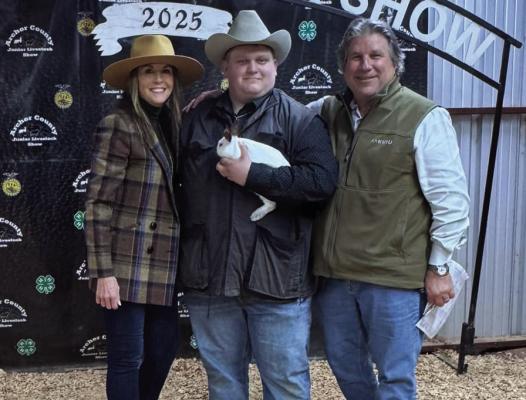 Archer County Junior Livestock Show Premium Auction participant #224 Justin Oliver was rewarded for his patience with a $10,000 bid from Christ and Terry Aulds. Courtesy photo/ACJLS