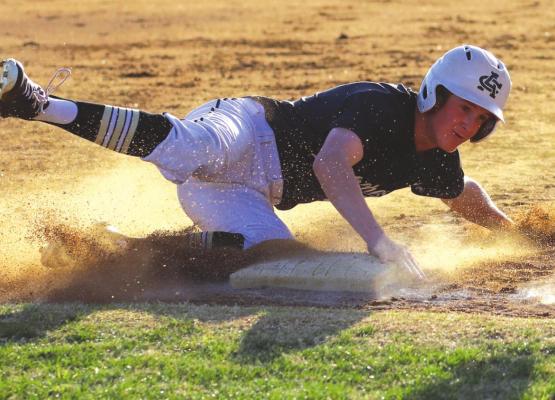Archer City’s Lane Lewis slides safely into third as the Wildcats knock off Windthorst 8-4 on Friday, March 25. Photo/Will Edwards