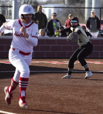 Archer City third baseman Adelyn Winter attempts to throw out a Lady Eagle batter in the Lady Cats’ battle with Holliday on Monday, Feb. 17. Photo/Landon Davis