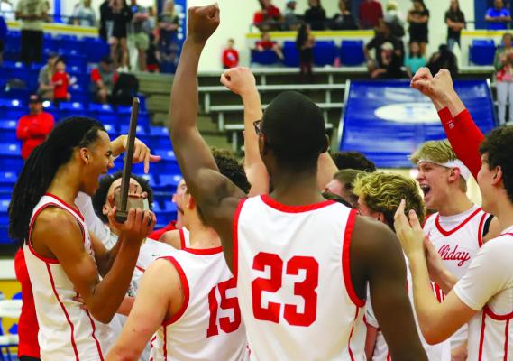 The Holliday Eagles Basketball team celebrates its regional finals 63-39 victory over Shallowater on Saturday, March 2, in Lubbock. Photo/Will Edwards