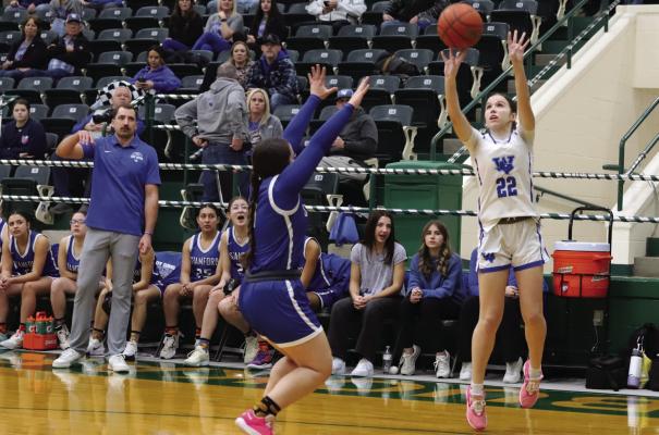 Trojanette freshman Makennah Frank attempts a three-pointer in the Bi-District round win over the Stamford Lady Bulldogs on Monday, Feb. 10. Photo/Landon Davis