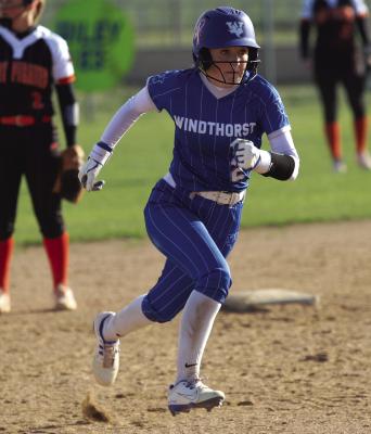 Trojanette second baseman Collins Mercadante races towards third base in Windthorst’s district home game versus Petrolia on Monday, March 16. Photo/Landon Davis