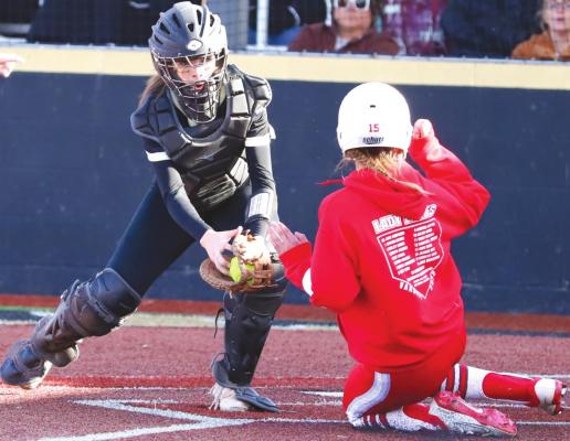 Holliday’s Hope Davis is tagged out at the plate in the top of the third inning of the Lady Eagles’ 3-0 win over Henrietta on Wednesday, March 23. Photo/Will Edwards