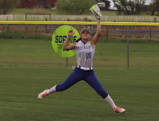 Trojanette leftfielder Catherine Hoff extends her body to make a grab on a hardhit ball against the Petrolia Lady Pirates on Thursday, April 17. Photo/Landon Davis