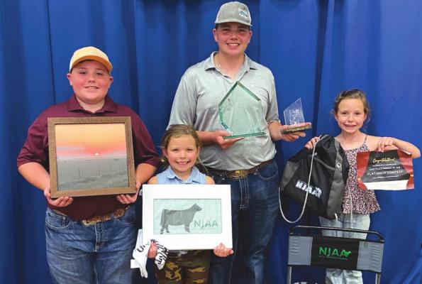 Brenlen, Brantley, Briella and Brystol pose with some their winnings from the National Junior Angus Show held from July 11 through July 17. Courtesy photo/Vivian Wolf