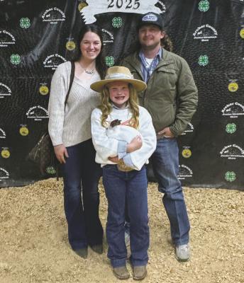 Parish Stubblefield poses with her Grand Champion Rabbit Project. Photo/Nathan Lawson
