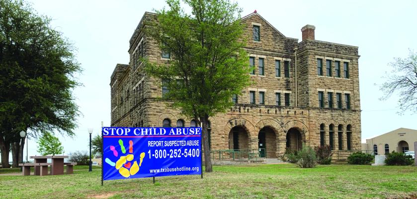 A Stop Child Abuse Sign was placed outside of the Archer County Courthouse in honor of Child Abuse Awareness Month in April. Photo/Nathan Lawson