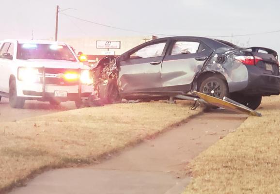 The car of a 16-year-old minor from Holliday came to a stop near the Archer City First United Methodist Church after leading officers on a high-speed chase Friday. Photo/Barbara Phillips