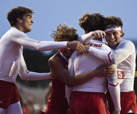 Holliday track members Ty Harrison (left), Noah Strohman (middle), Steele Skinner (middle) and Vaughn Hamill celebrate Skinner's come from behind victory to secure a gold medal for the Eagles 4 x 400 relay team on Thursday, May 1. Photo/Micah McCartney, Wise County Messenger