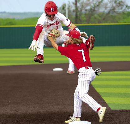 Holliday’s Peyton Marchand is tagged out trying to stretch a double to a triple in the first inning of the Eagles’ 11-2 win over Jim Ned in Iowa Park. Photo/Will Edwards