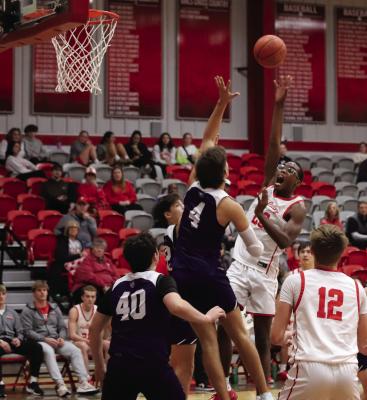 Holliday’s Eric Bristow tosses up a mid-range floater over a pair of Jacksboro Tigers in the Eagles’ 62-45 win on Friday, Jan 10. Photo/Landon Davis