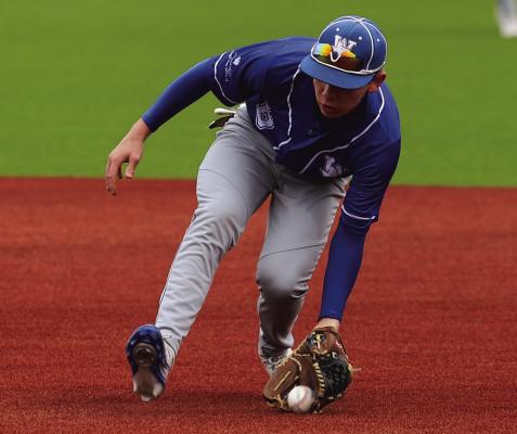 A Windthorst secondbaseman scoops up a groundball during the Rooster Classic baseball tournament. Photo/Landon Davis