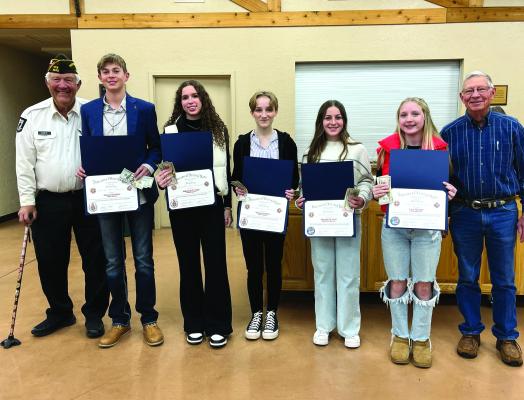 L-R: Claude Hoff (VFW Post 2676 Commander), Jackson Davidson, Holliday High School (1st Place VOD); Makennah Frank, Windthorst High School (2nd Place VOD);TaraAnn Lambert, Holliday High School (3rd Place VOD), Meredith Hoff, Windthorst Jr. High (1st Place PP); Lucy McDuff, Holliday Middle School (2nd Place PP) and John Luig (VFW Post 2676 Auxiliary President); not pictured Lyla Richardson, Holliday Middle School (3rd Place PP). Courtesy photo