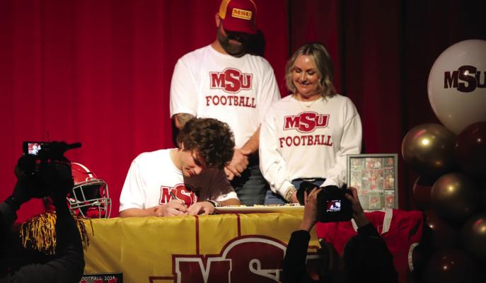 Holliday’s Swiss Army Knife Steele Skinner signed his letter of intent to play football at Midwestern State on Wednesday, Feb. 5, in the Holliday High School Auditorium. Photo/Landon Davis