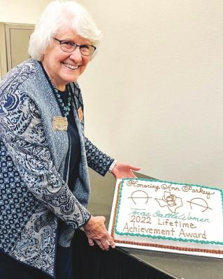 Ann Parkey poses for a photo with her Texas Cattlewoman Lifetime Achievement Award broach and cake at the organization's spring convention on March 26. Courtesy photo