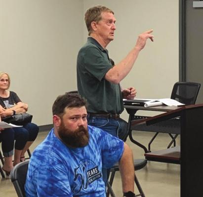 Lakeside City city contracted engineer, Dean Hinton, of Corlett, Probst and Boyd presents changes to the Shoreline/Skyline intersection project during the city council meeting Monday. Photo/Nathan Lawson