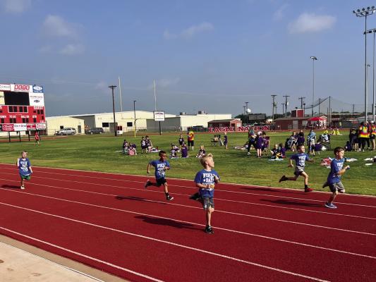 The Holliday Elementary School celebrated its field day on Friday, May 12. The day consisted of races and tug of war depending on age. Pictured is a race between first graders Photo/Grace Rees