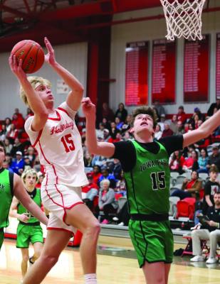 Holliday’s Ashtyn Berry soars through the air for a layup in the Eagles’ home district game versus the Hawks on Friday, Jan. 31. Photo/Landon Davis