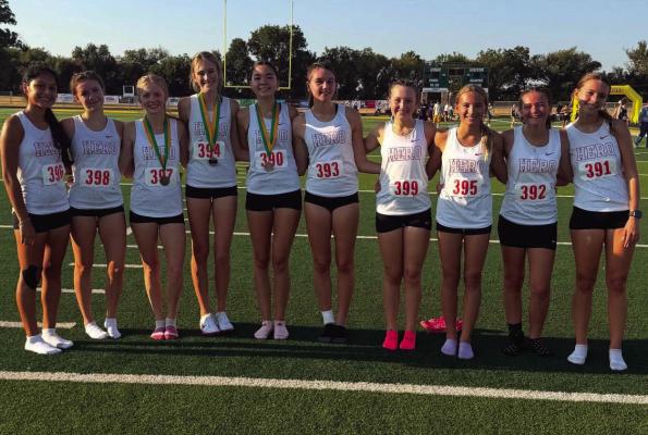 The Holliday Lady Eagles pose for a photo following their first place finish at the Boyd Yellow Jacket Invitational on Friday, Aug. 28. Courtesy photo