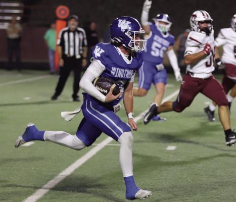 Windthorst quarterback Brock Belcher slices his way for a rushing touchdown against the Broncos on Friday. Photo/Landon Davis