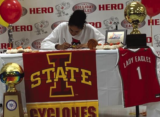 Holliday senior Jalynn Bristow signs her National Letter of Intent to continue her basketball career at Iowa State on Wednesday, Nov. 16. Photo/Nathan Lawson