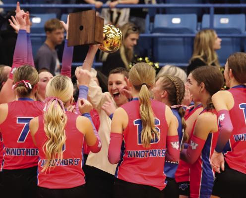 Head Coach Allison Bussey and the rest of the Windthorst Trojanettes celebrate after their 3-0 sweep over Vega in the Regional Finals round in Childress. Photo/Landon Davis