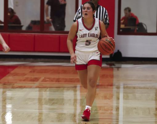 Holliday’s Bella Timms dribbles the ball down the court in the Lady Eagles’ first home game of the season. Photo/Landon Davis