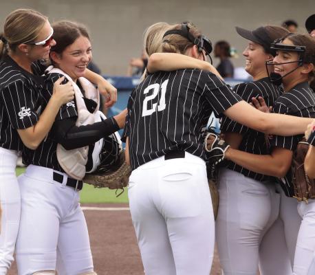 The Lady Cats surround freshman catcher Adelyn Winter and freshman shortstop Millie Mayo after Winter rifled a throw to Mayo to catch a Moody runner stealing second. Photo/Landon Davis