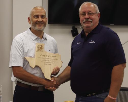 Outgoing Lakeside City Mayor Cory Glassburn (left) was presented with a plaque by Director of Opertaions Donald Stevens for his service as Mayor. Photo/Landon Davis