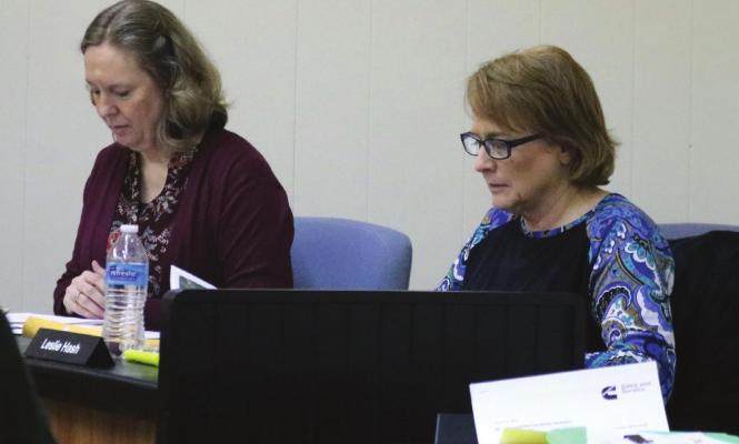 Council members Debra Haehn and Leslie Hash study maps showing proposed water line replacement locations at last Monday evenings council meeting. Photo/Jerry Phillips