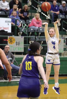 Guard Courtney Peterson buries a three for the Trojanettes in their Area-round bout with Lipan on Thursday, Feb. 19. Photo/Landon Davis