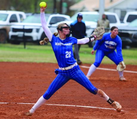 Trojanette pitcher Jalyn Benson fires a pitch against the Archer City Lady Cats on Friday, March 27. Benson didn’t allow a single run in the 15-0 win. Photo/Landon Davis