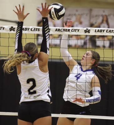 Windthorst Sophomore Haddy Steinberger looks for a kill over Archer City's Senior Addi Canada in the Trojanette's 3-0 win over the Lady Cats on Tuesday, Sept. 29. Photo/Rolando Medina