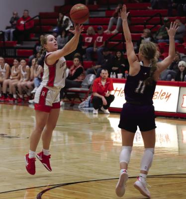 Senior guard Braylie Womack attempts a three-pointer in Holliday’s home district matchup against the Jacksboro Tigerettes. Photo/Landon Davis