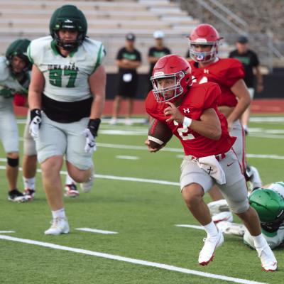 Holliday senior Caleb McClane hustles towards the endzone in the Eagles’ scrimmage against the Hawk in Iowa Park on Friday, Aug. 15. Photo/Landon Davis