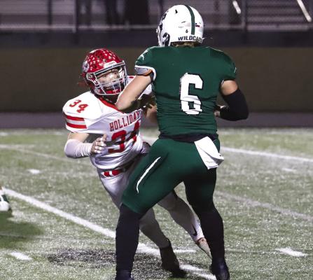 Holliday’s Collin Hays prepares to lay a monster hit on Scurry-Rosser quarter Tyler Vaughn in the fourth quarter of the Eagles’ 31-10 area round win over the Wildcats on Thursday, Nov. 17, in Weatherford. Photo/Will Edwards