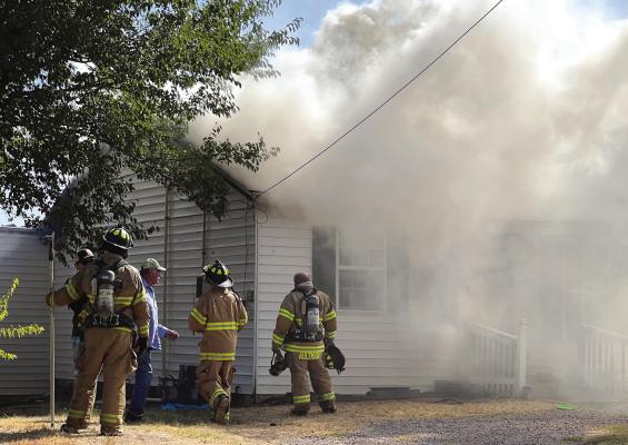 The Archer City Volunteer Fire Department fought a stucture fire on E. Pecan St. on Sunday Aug. 14. The residents were not home at the time of the fire and the fire is believed to be electical in nature. Photo/Barbara Phillips