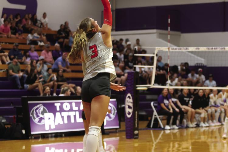Holliday Senior Emma Ellis delivers a serve during the Lady Eagles 3-1 win over the Tolar Lady Rattlers. Photo/Rolando Medina