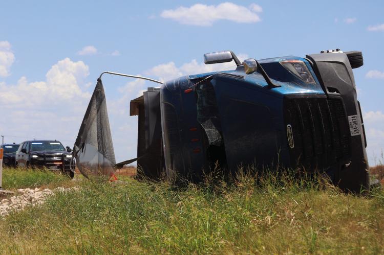An 18-wheeler hauling rock lost control and rolled over traveling west on Hwy. 25 past Ferguson Road on Wednesday, July 8. No injuries were reported. Photo/Nathan Lawson