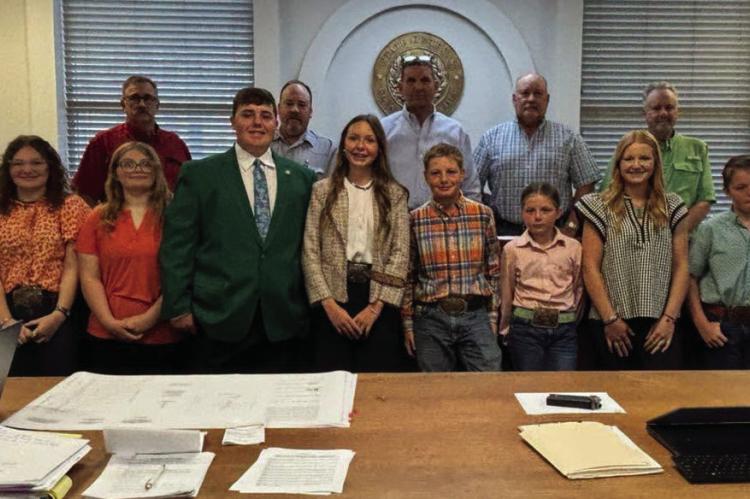 The Archer County Commissioner's Court poses for a photo with members of Archer County 4-H following the proclamation of National 4-H week in Archer County from Oct. 4-10. Courtesy photo