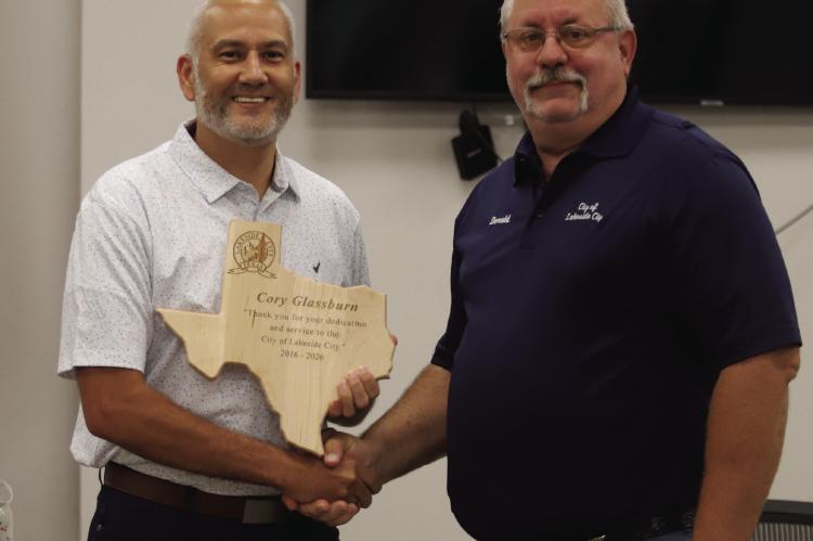 Outgoing Lakeside City Mayor Cory Glassburn (left) was presented with a plaque by Director of Opertaions Donald Stevens for his service as Mayor. Photo/Landon Davis