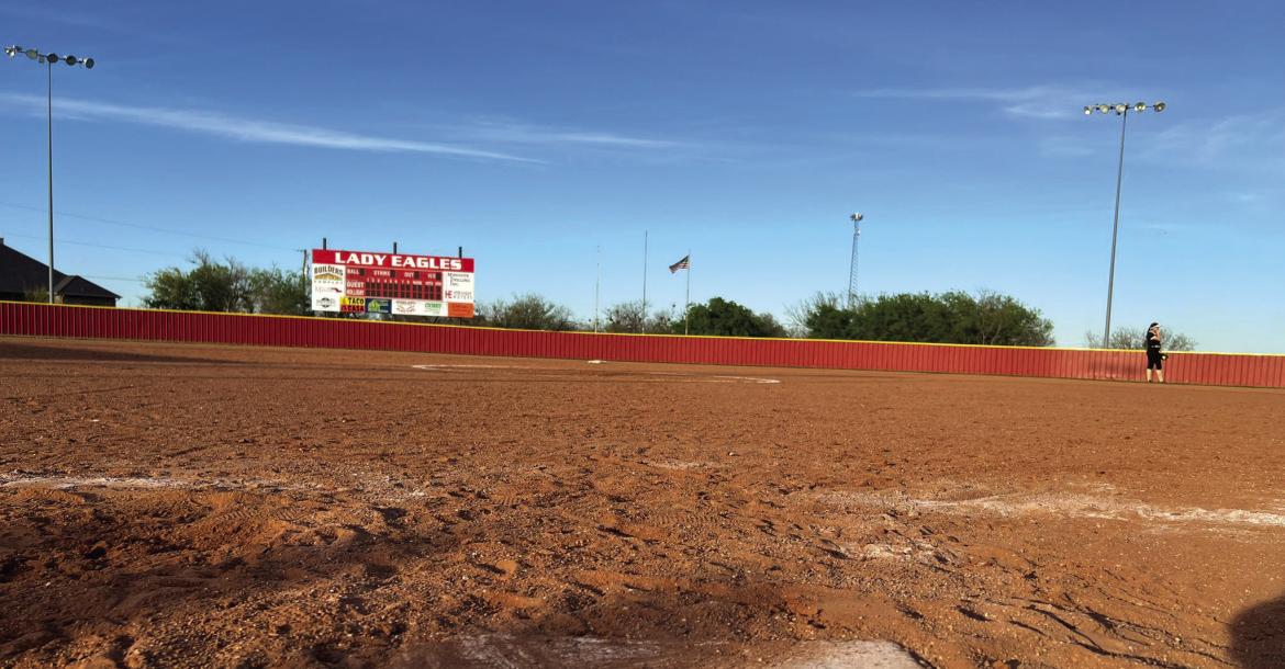 The Holliday Lady Eagles played the final game on its dirt field on Thurs., March 28, picking up a 17-7 win over rival Henrietta. Photo/Will Edwards
