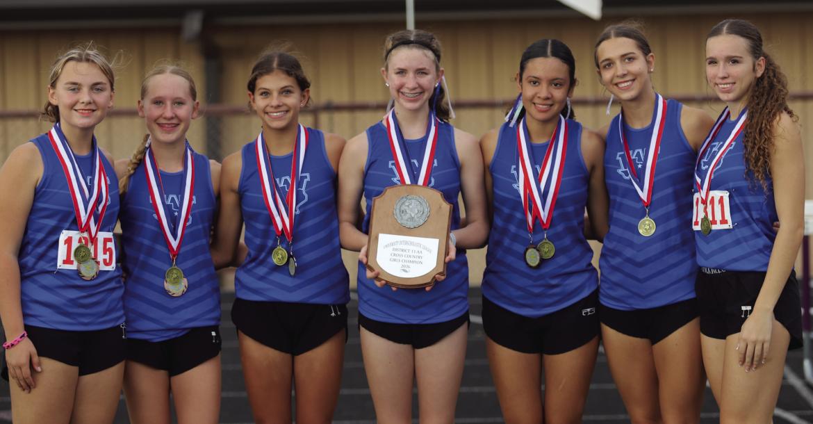 The Windthorst Trojanettes took home the 2A District 11 Cross Country Title on Wednesday, Oct. 14. L-R Lilli Meuer, Elizabeth Kolar, Elizabeth Schroeder, Adley Reynolds, Zenaida Puente, Charlie Bone and Makennah Frank. Photo/Rolando Medina