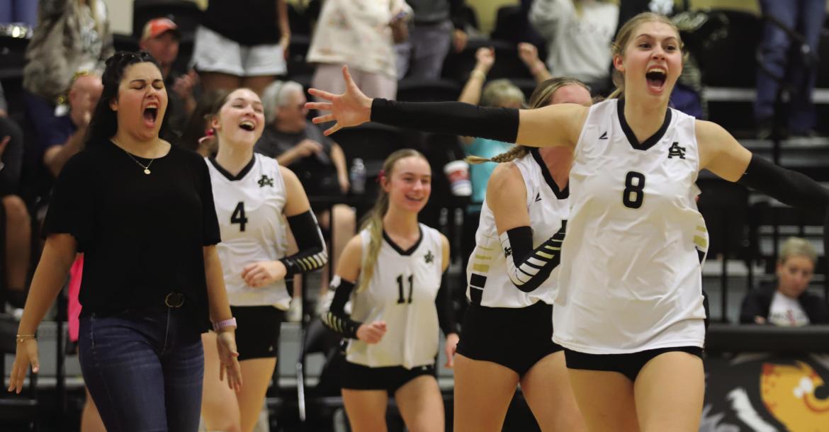 Archer City Head Coach AJ Diaz, Sophomore (8) Lyla Nichols and the rest of the Lady Cats celebrate following Archer City's 3-0 win over Olney on Tuesday, Oct. 13. Photo/Rolando Medina