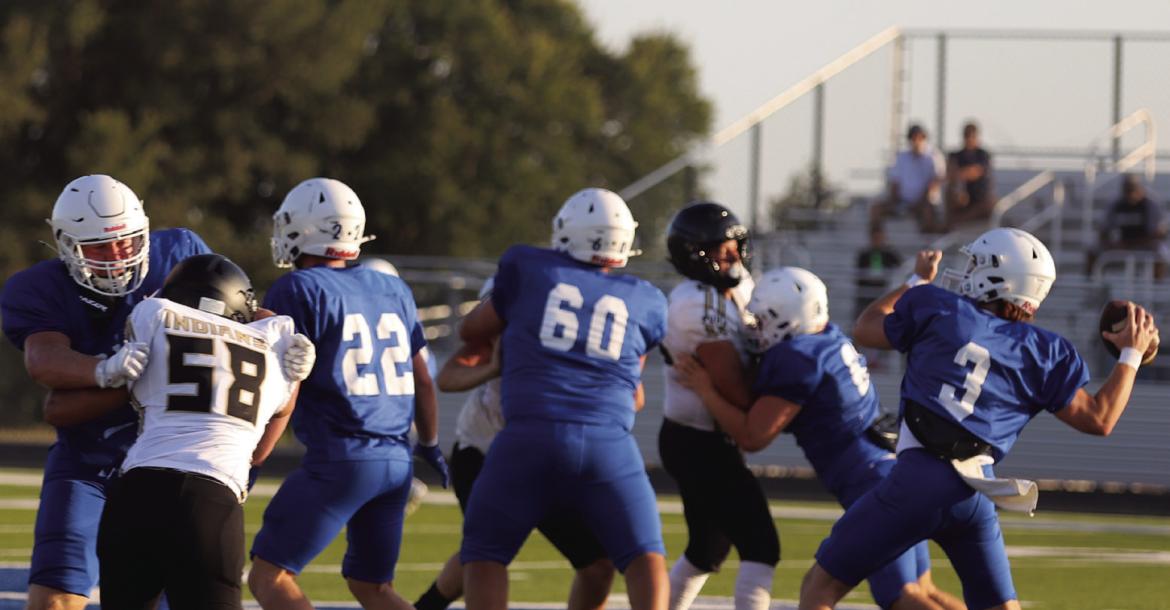 Windthorst Quarterback Brock Belcher lines up a pass during the Trojans scrimmage against the Quanah Indians on Thursday, Aug. 13. Photo/Rolando Medina