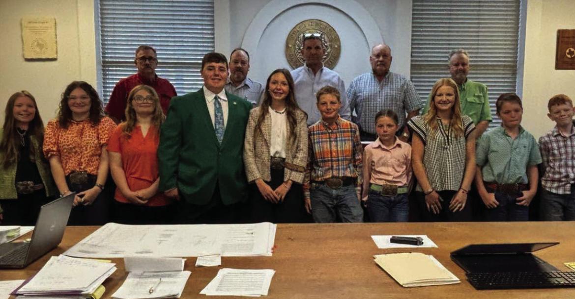 The Archer County Commissioner's Court poses for a photo with members of Archer County 4-H following the proclamation of National 4-H week in Archer County from Oct. 4-10. Courtesy photo