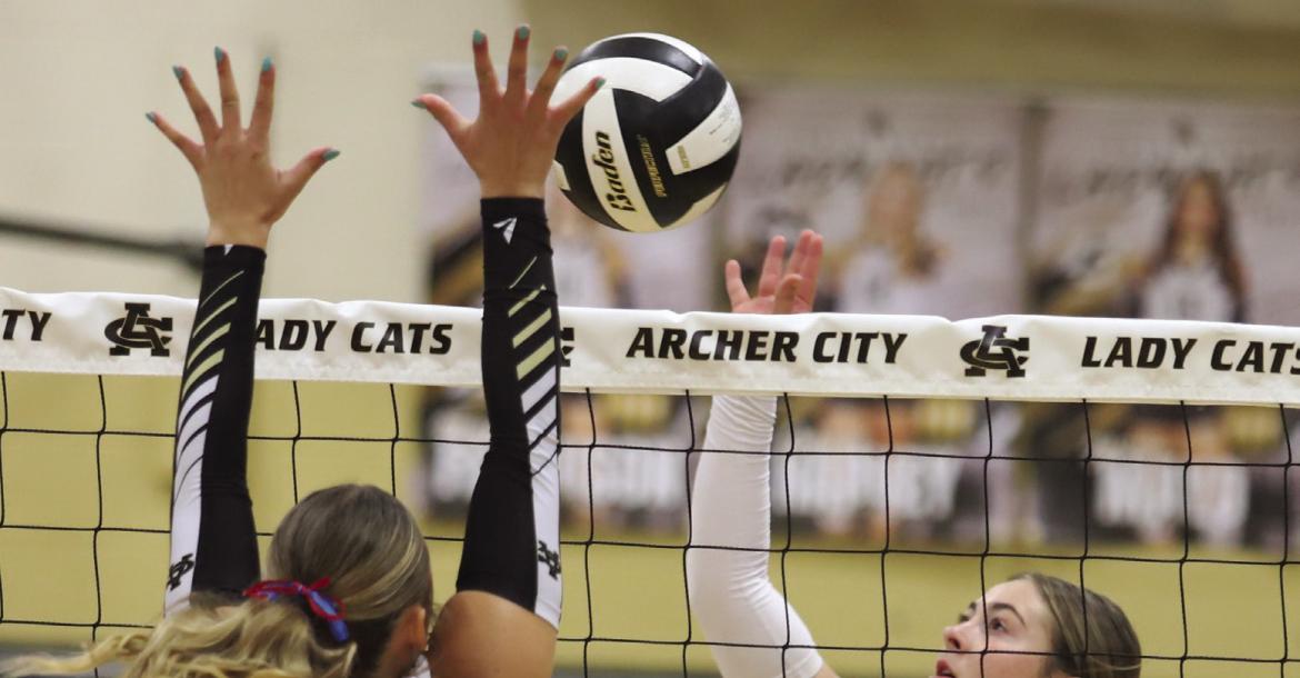 Windthorst Sophomore Haddy Steinberger looks for a kill over Archer City's Senior Addi Canada in the Trojanette's 3-0 win over the Lady Cats on Tuesday, Sept. 29. Photo/Rolando Medina